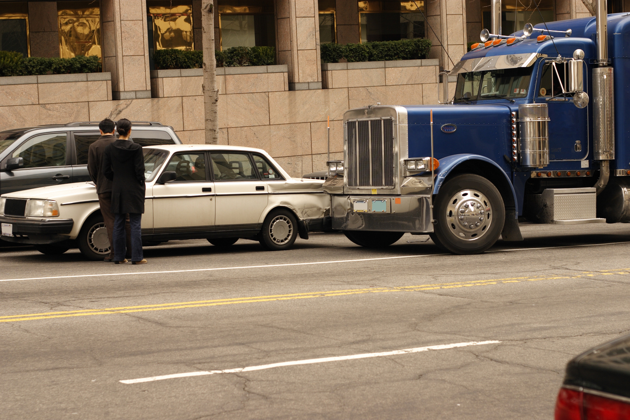 Car and semi tractor trailer in a fender bender in down town Washington DC